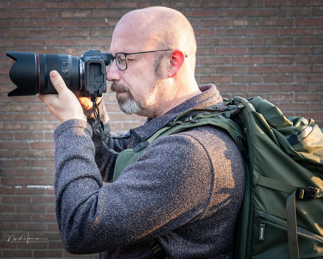 Using the Op-Tech backpack connectors with the QD system. There is no need to disconnect the camera. But it can be done easily, if needed.