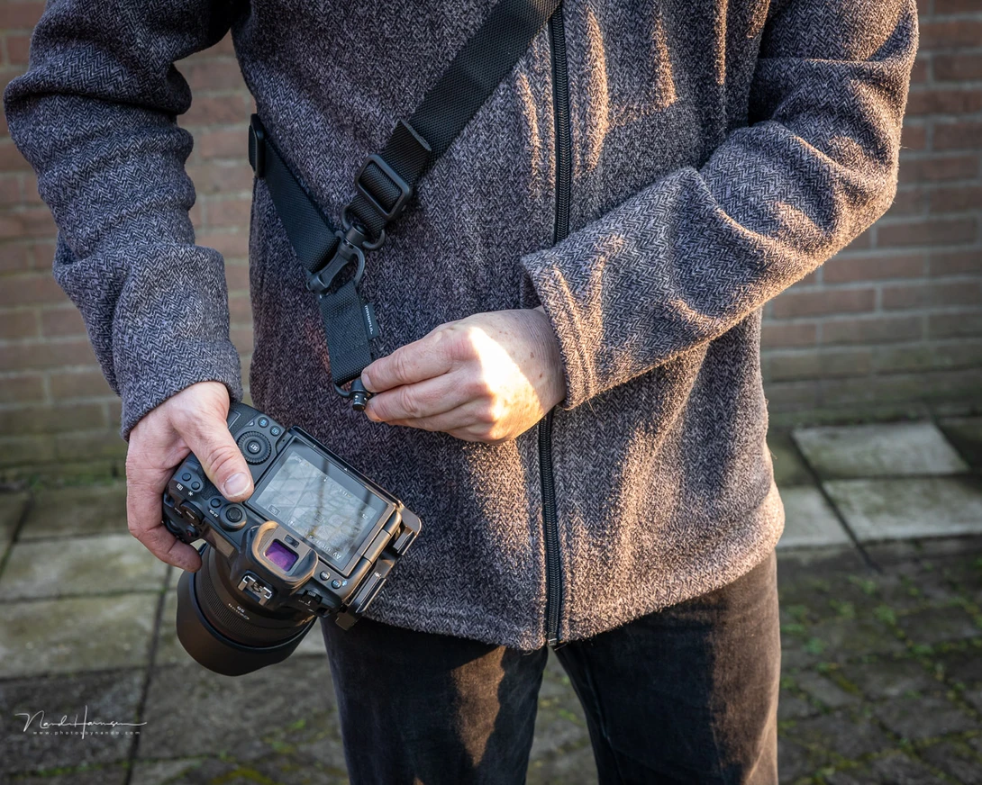 I discovered the QD system thanks to Really Right Stuff. I also bought a sling to carry the camera if I'm not using a camera bag.