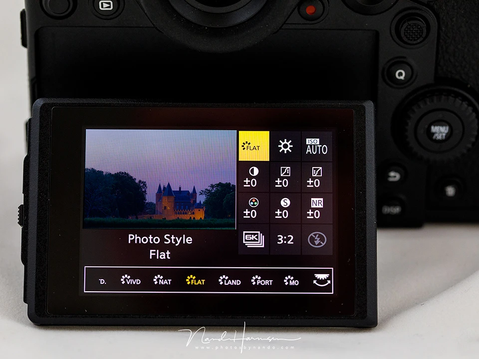 Screenshot of a mirrorless camera's rear LCD screen displaying photo style settings and exposure information.