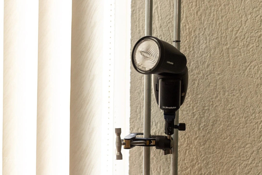 The Frio system offers a good way of securing a flash or other device on many locations. It's low profile and doesn't require the need of a light stand.