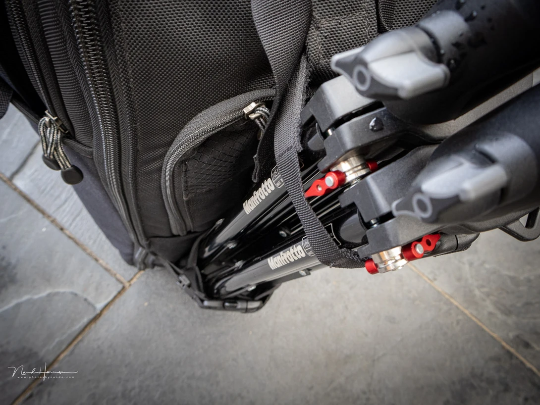 One of the downsides is the inability to use the side pocket when a tripod or light stands are connected.