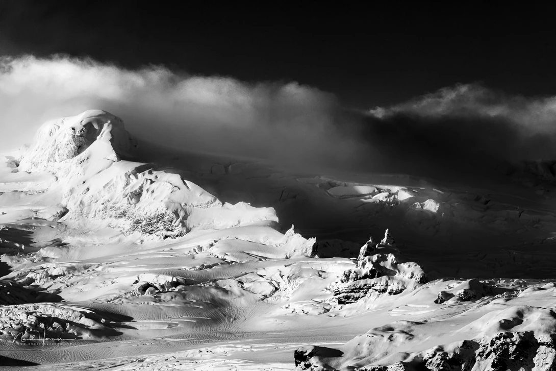 The light was playing onto this glacier in Iceland. The only color was blue, in different shades. It became a stronger image in black and white.&nbsp;