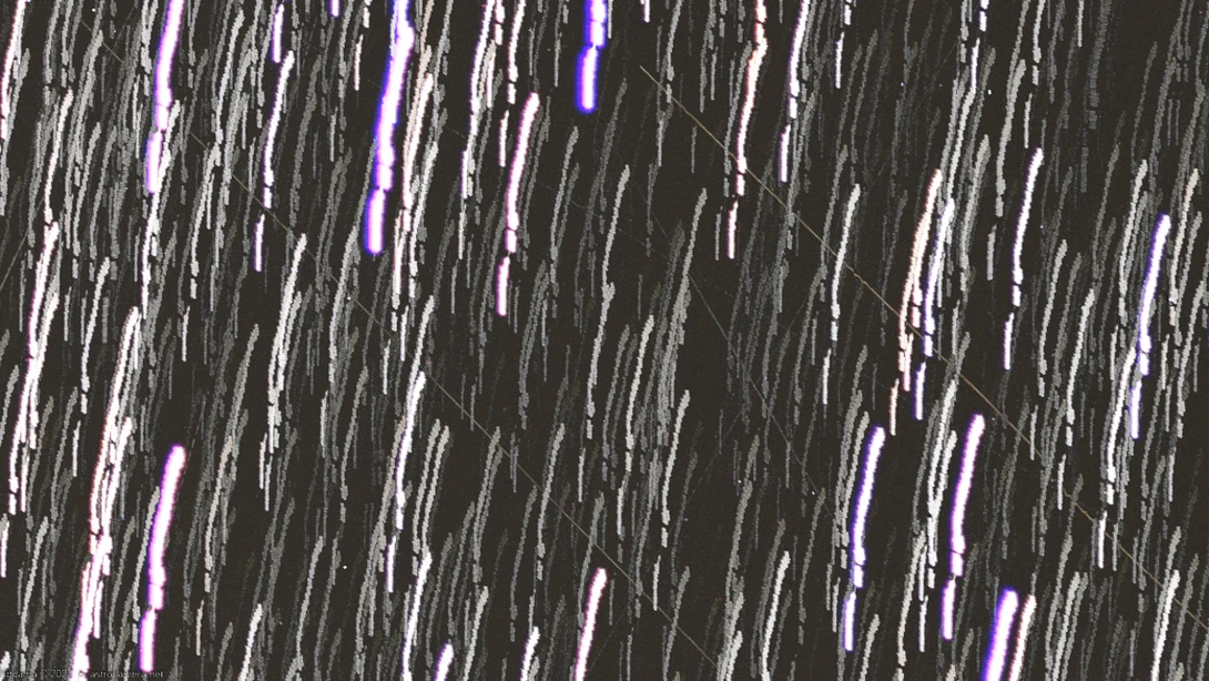 Abstract vertical streaks of white and purple light against a dark charcoal background.