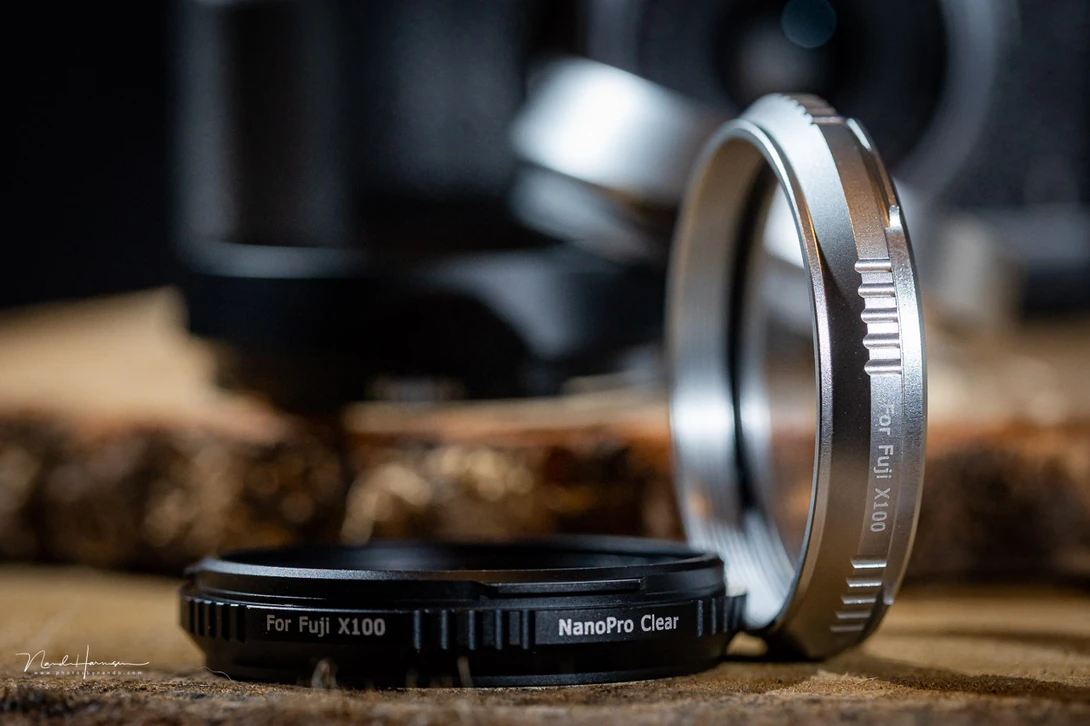 The Haida NanoPro X100 Clear Filter and the NanoPro X100 Mist Black 1/4 filter. One in the silver finish, the other one in black.