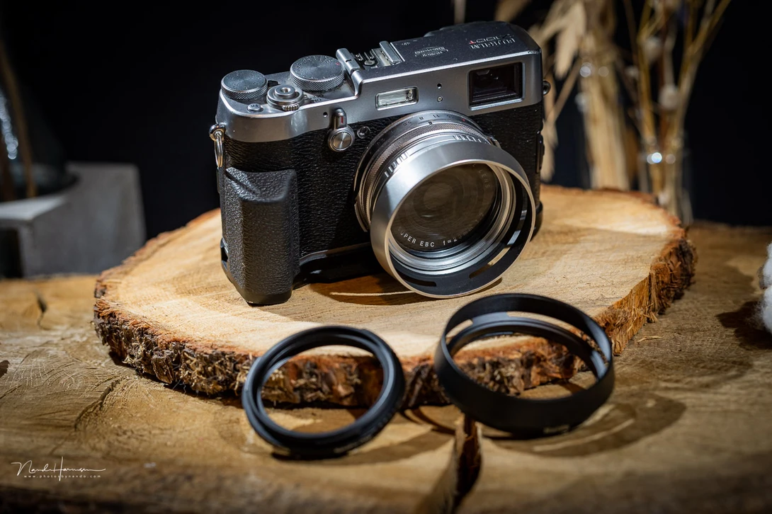 The Fujifilm X100 T with a Haida NanoPro X100 Mist Black 1/4 filter and lens hood installed.