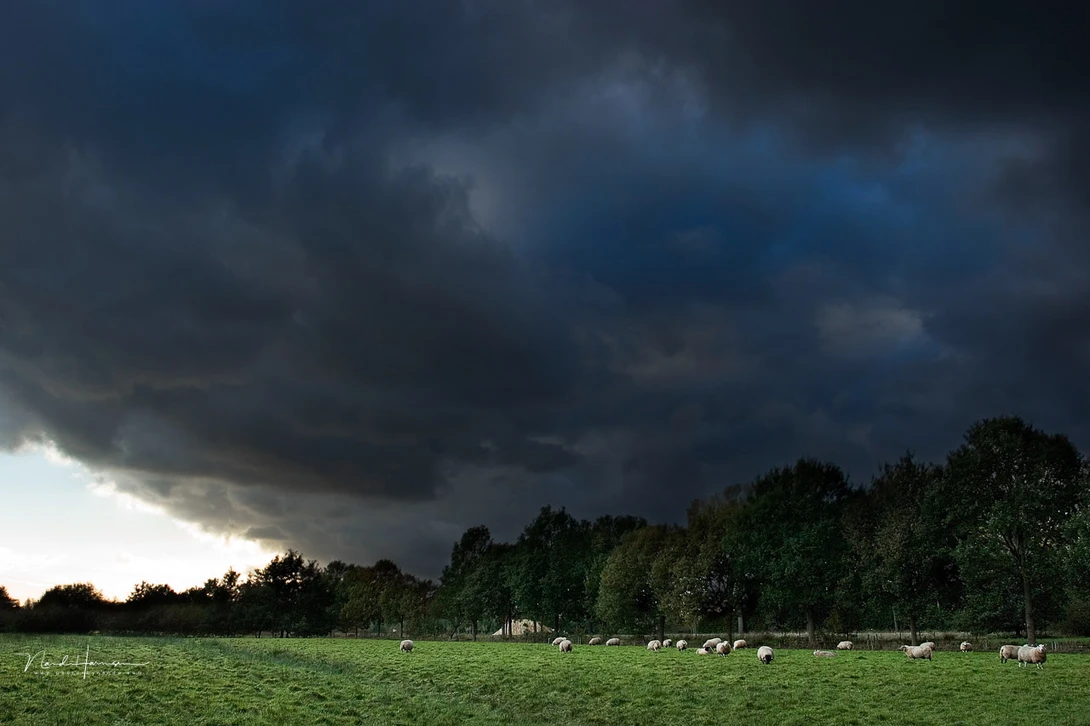 A tranquil landscape under stormy clouds. This can be considered juxtaposition. But it also shows juxtaposition is not a substitute for a good composition.