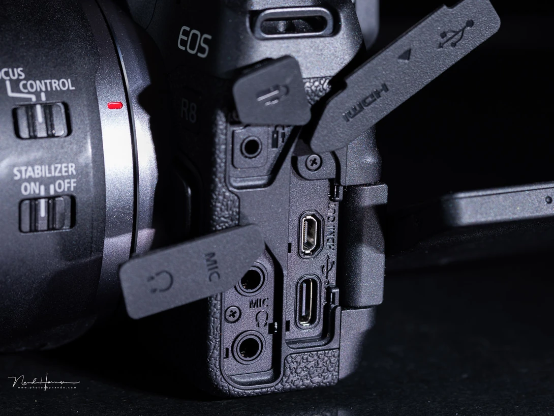 The Canon EOS R8 is equiped with every necessary port. It also has a headphone jacket, which is convenient.