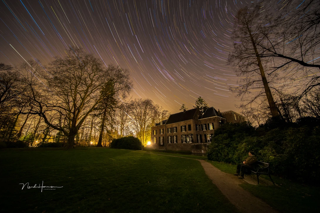 Sitting on a bench waiting while the camera is capturing the images for startrails. Enjoy the time in the dark, looking at the stars.