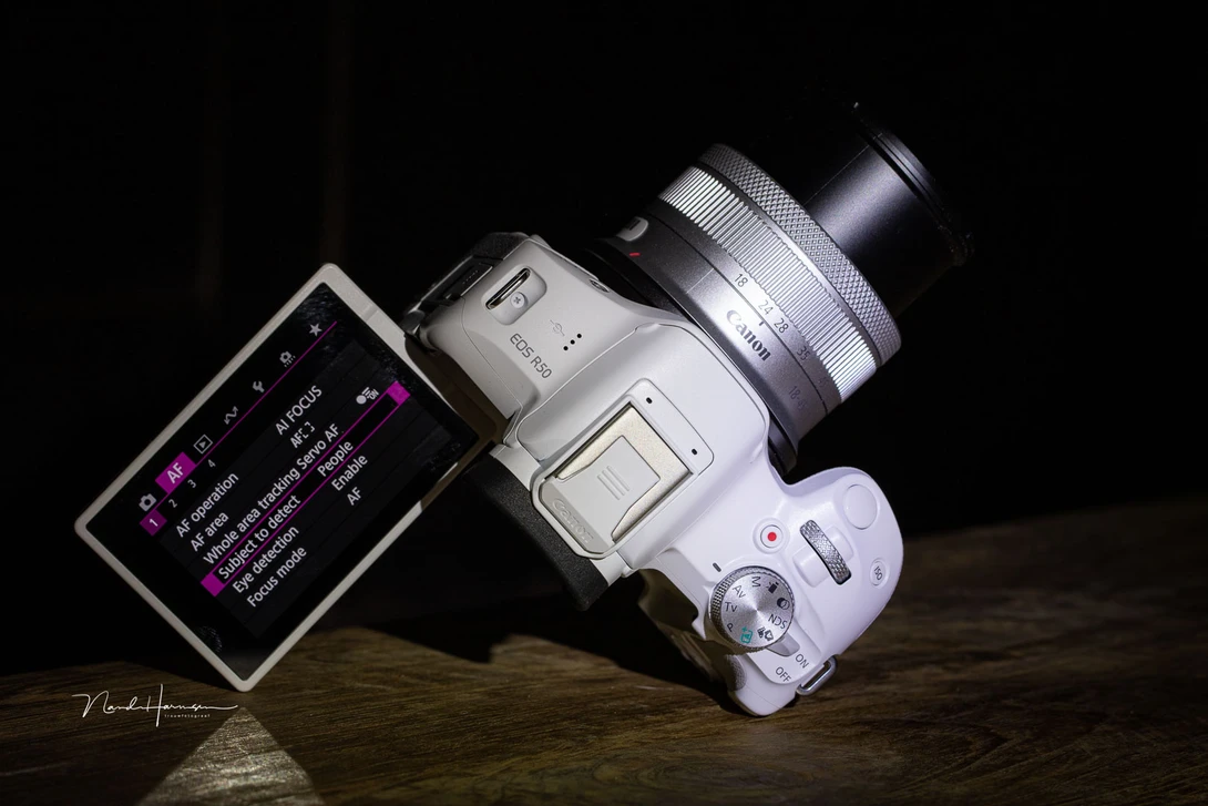 Use the touch screen functionality of the Canon EOS R50 for most of the settings.