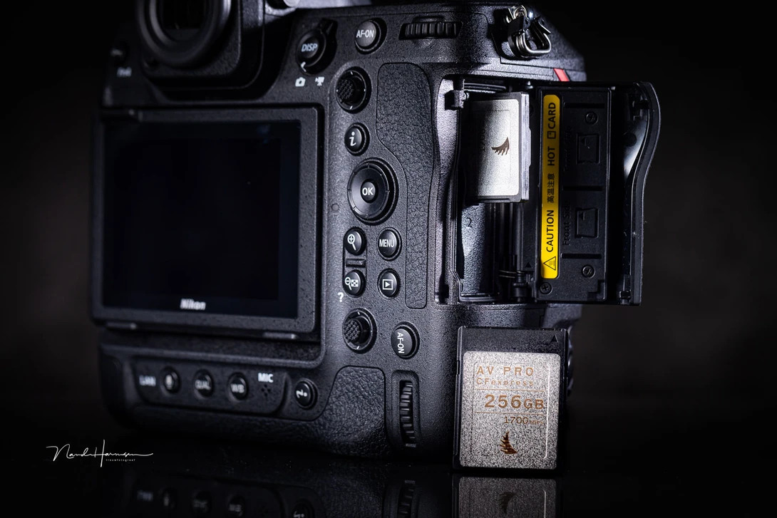 An example where the upgrade to a more sophisticated camera leads to the extra expense of buying the necessary expensive memory cards.