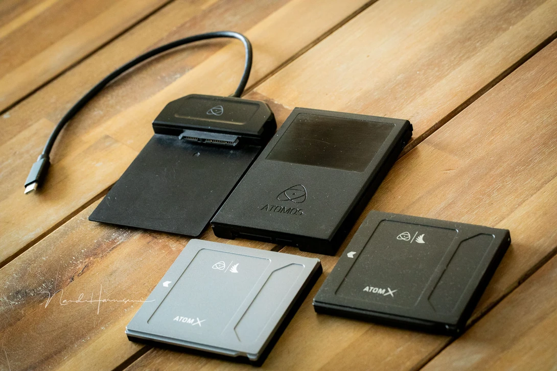 Three SSD drives and a cradle to connect the drive to a computer.&nbsp;