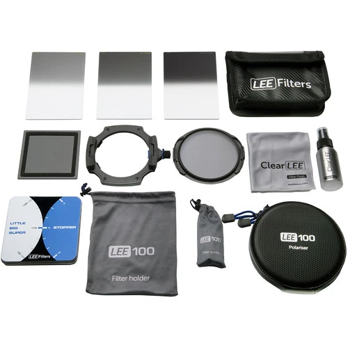 Lee Filters 100mm filter system components laid out including gradient ND filters, circular polarizer, filter holder, and accessories.