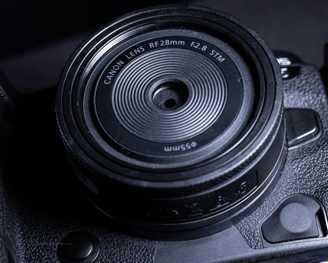 The front lens is tiny. Still, the maximum aperture is f/2.8