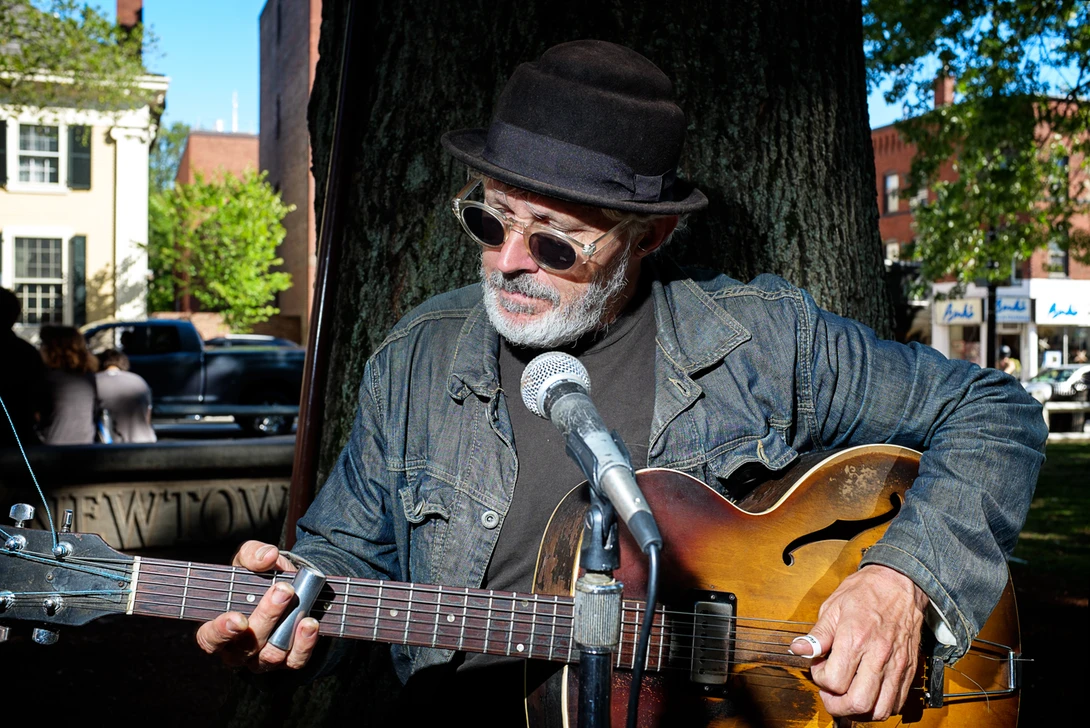 guitar player performing in the park