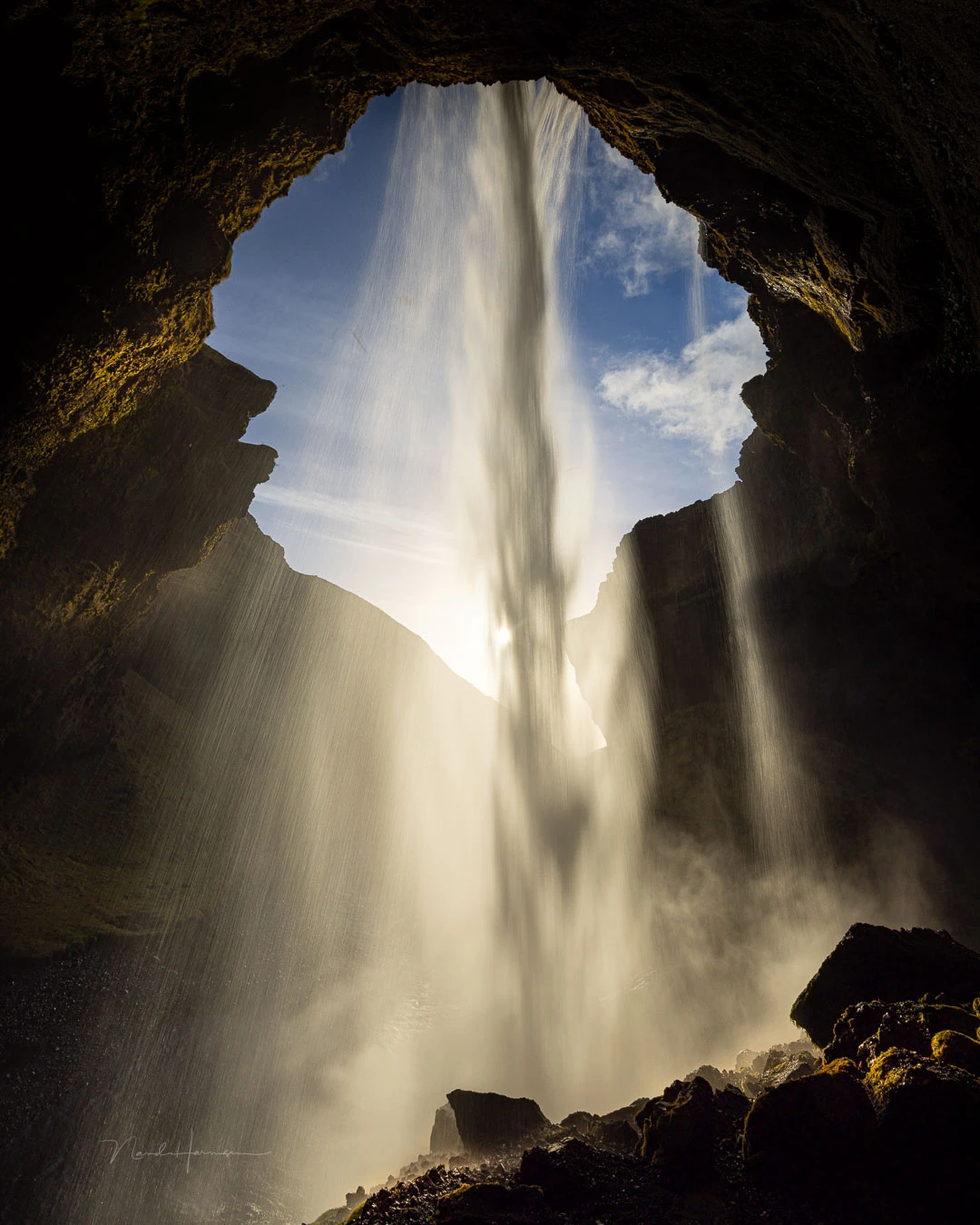 Find a special perspective, use backlight if possible, and use a short shutter speed to capture the strength of the waterfall. This is 1/13 sec.