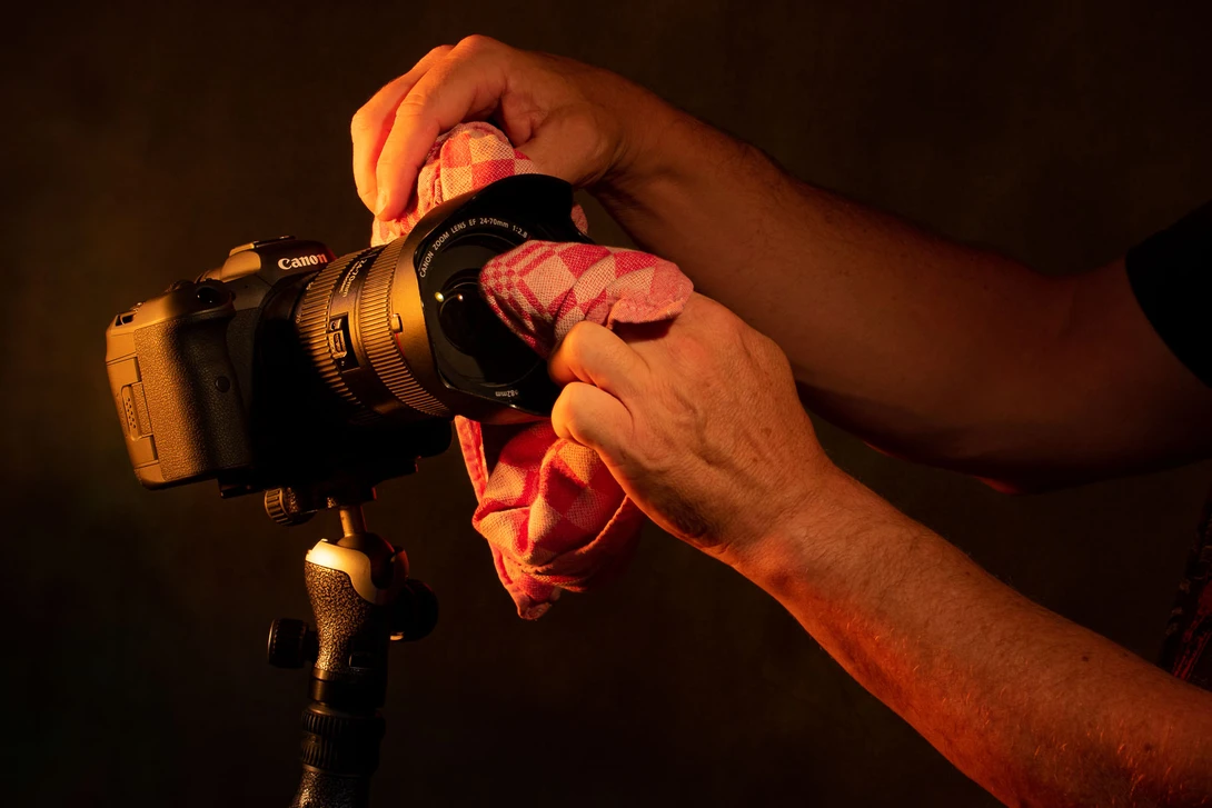Nothing beats a dish towel for cleaning your lens.