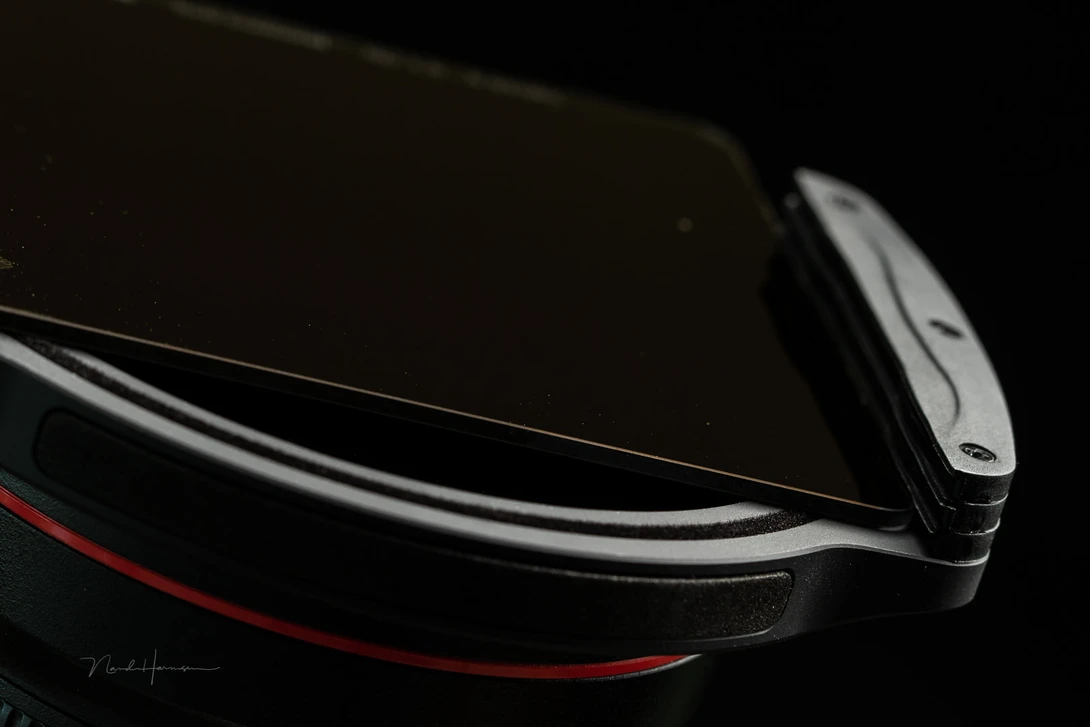 It may be expensive, and you need to carry a lot of extra gear, but nothing beats a normal ND filter. Forget about variable ND filters, unless you're a videographer.