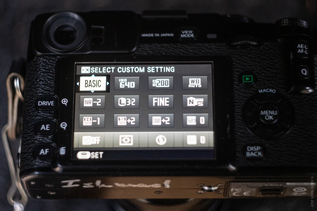 Screenshot of a digital camera's custom settings menu displaying exposure, drive, and autofocus options.