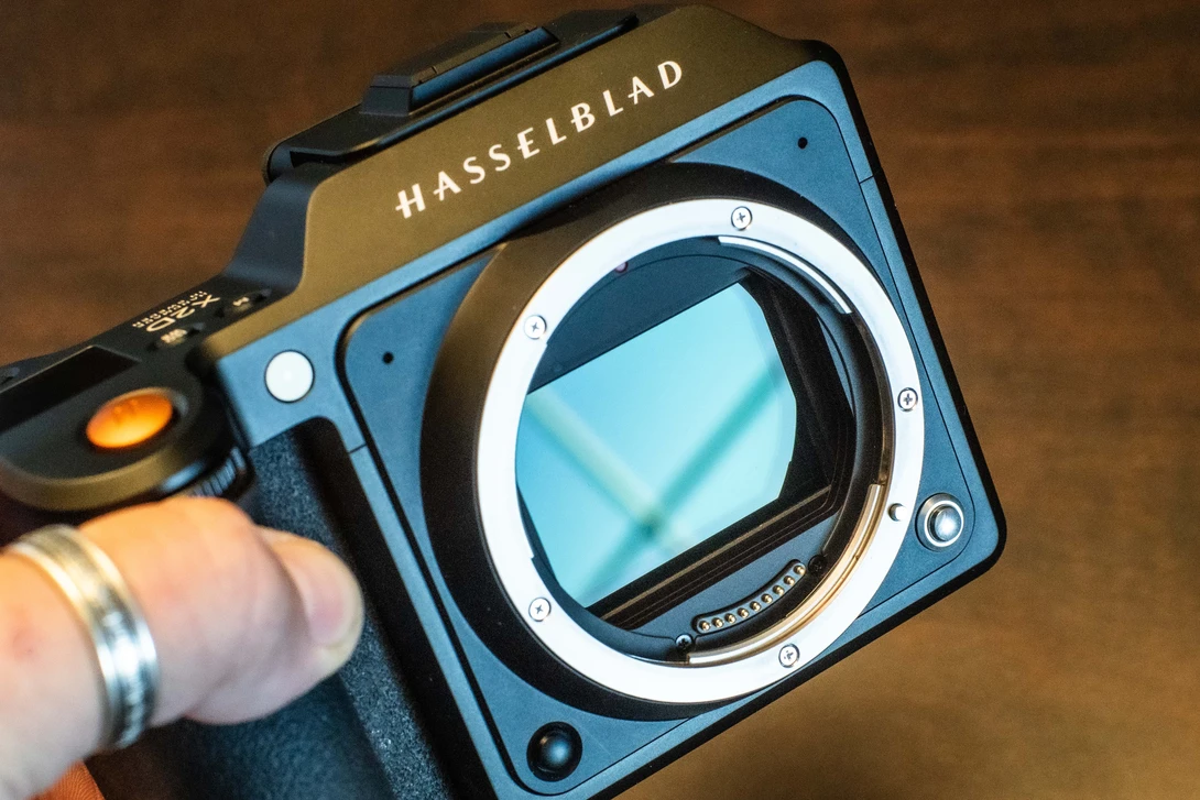 Hasselblad medium format camera body with open mirror box, showing the sensor and internal mechanism.