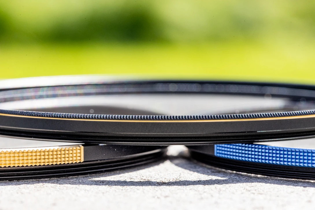 The Haida Premium Brass UV on the left, the Bluestone UV on the right, and on top the brand new Haida Greystone UV filter.