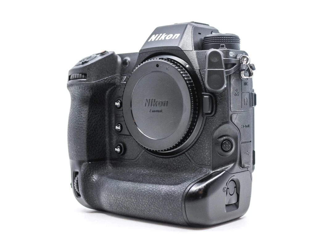 Nikon professional DSLR camera body with integrated vertical grip, shown against white background.