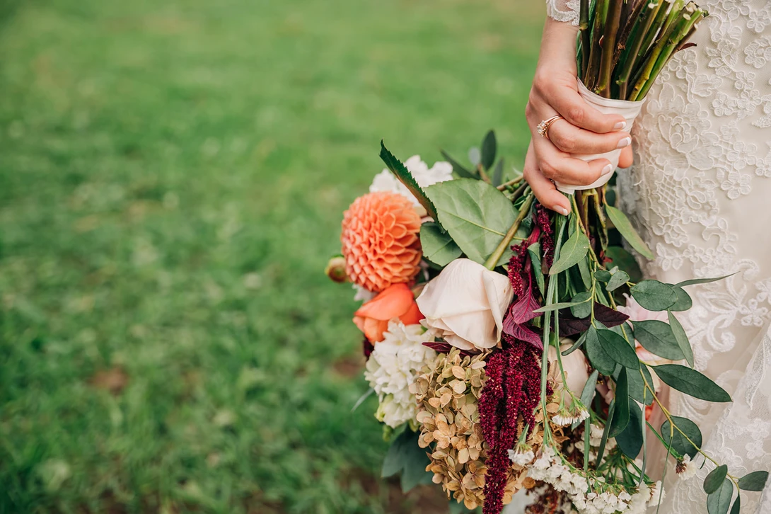Bride holds bouquet in example of wedding photojournalism
