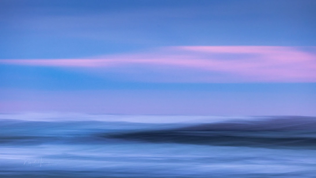 A mix of coastal line and the surf, with a hint of twilight colors.