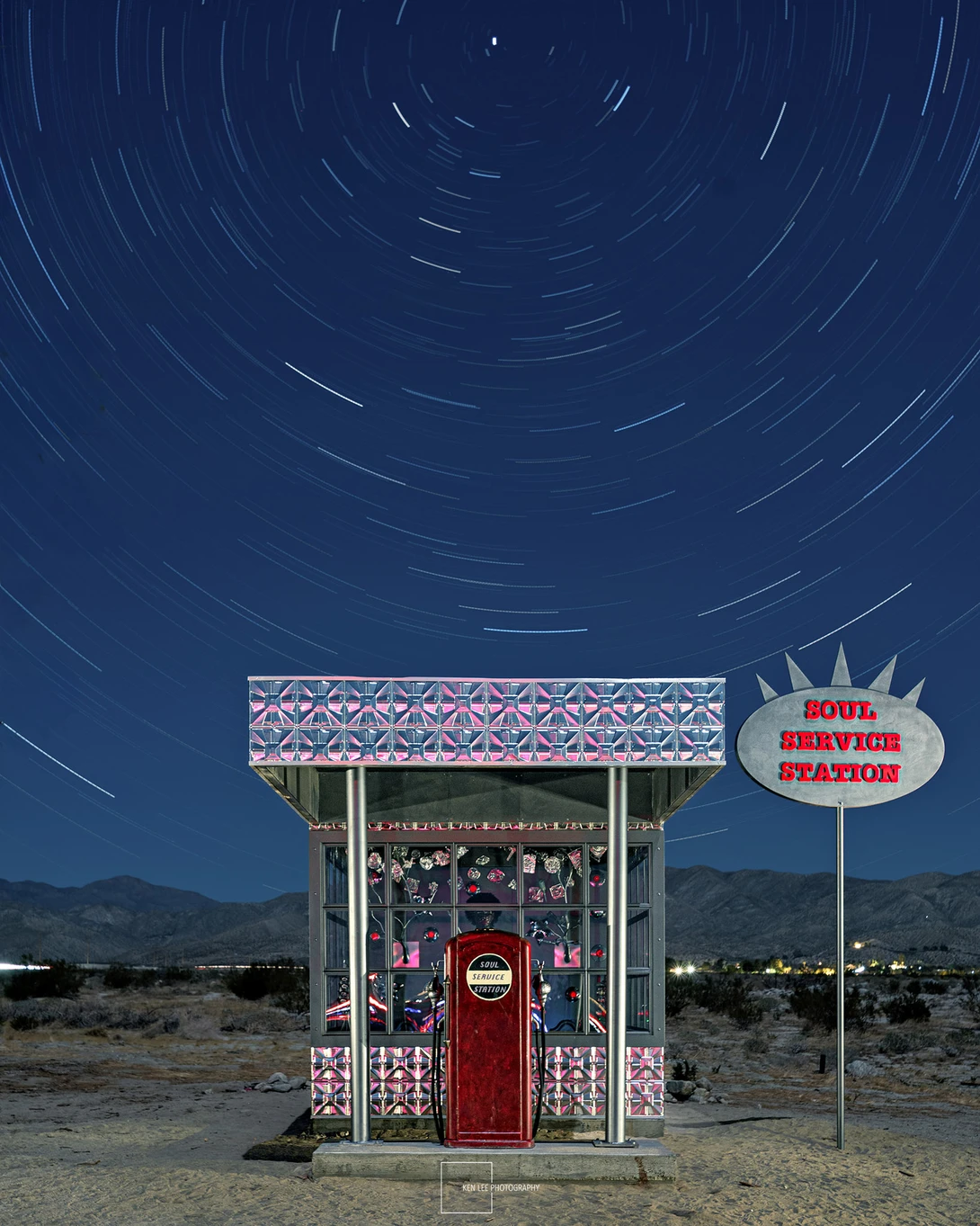 Night photo with light painting and star trails. Desert X art installation called "Soul Service Station" by Alison Saar, located in Desert Hot Springs, California.