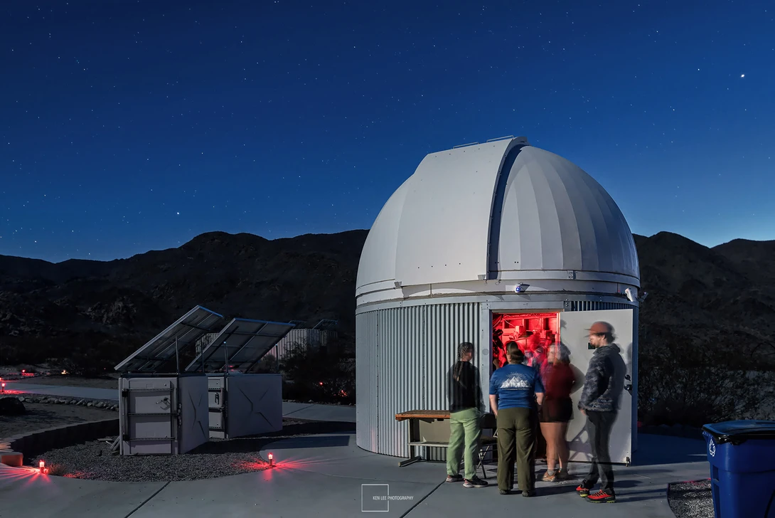 A high school group and volunteers entering Sky's the Limit Observatory in Twentynine Palms, California