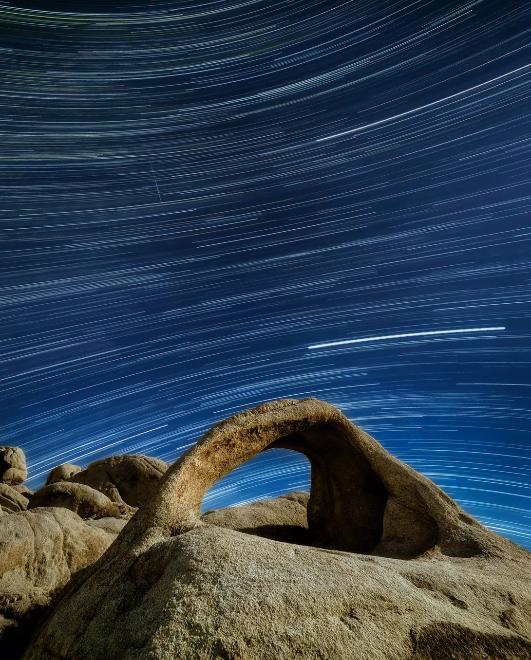 Star Trails over an arch in Mojave Desert, California.