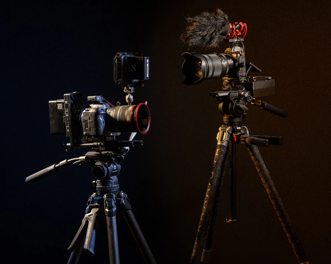 I would prefer the original one for heavy setups. It's not because of the tripod, but because of the video head.