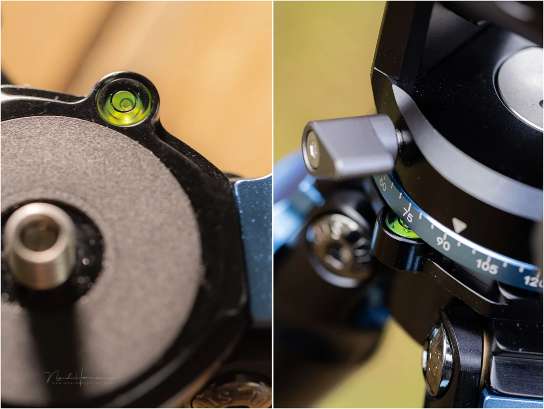Close-up detail of a camera's tripod head and spirit level bubble indicator.