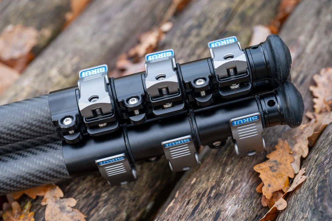 Row of six rifle iron sights mounted on a black tactical rail system.