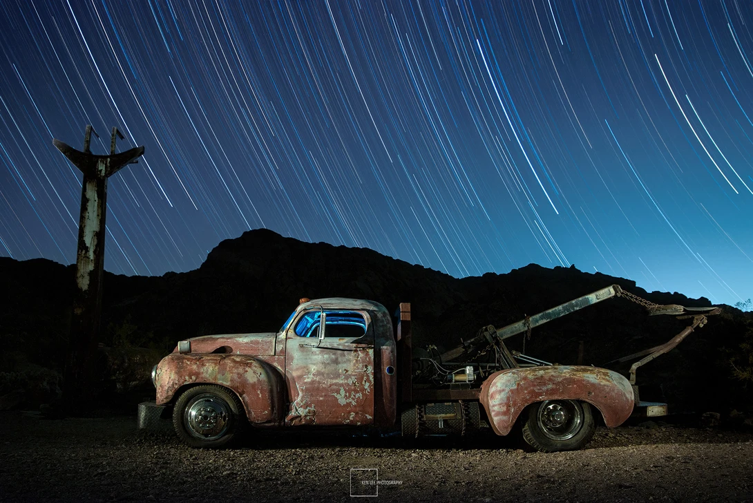 Tow truck with star trails and light painting at night, Nelson Ghost Town, NV