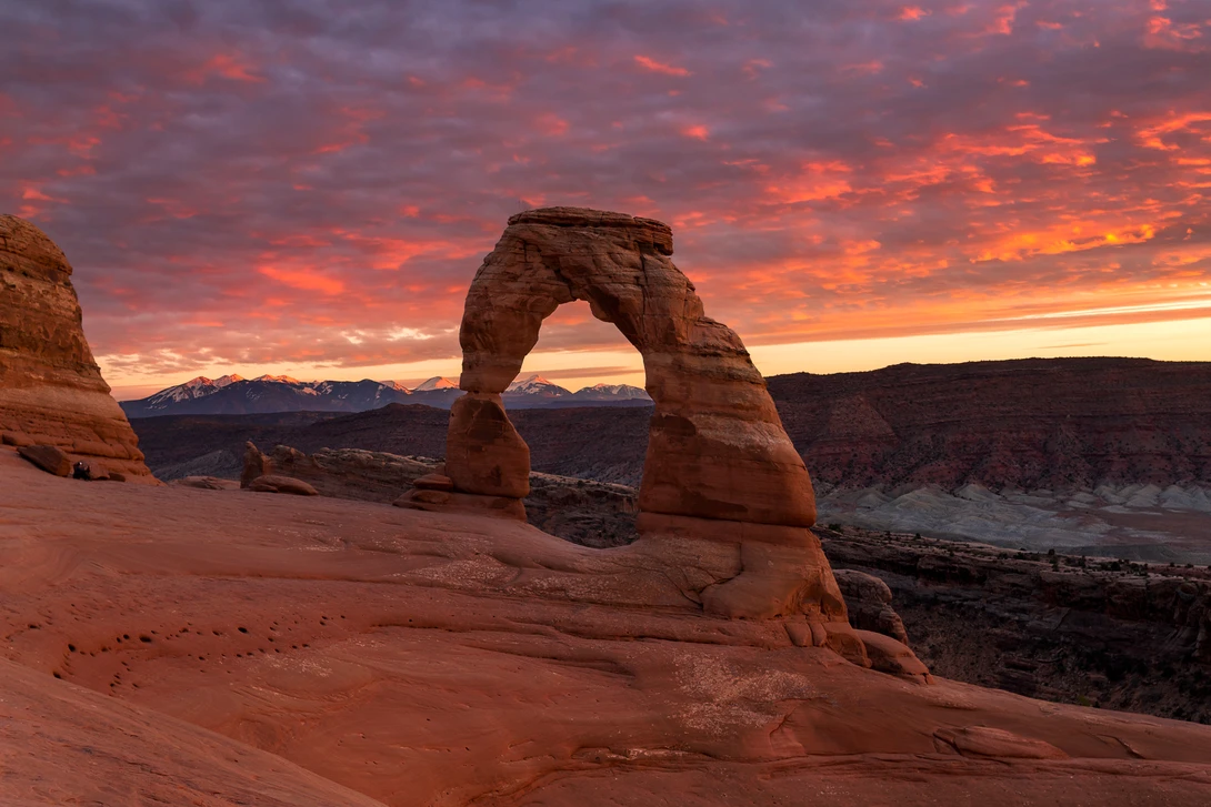 View Fiery Sky Above Delicate Arch by Nick Souvall