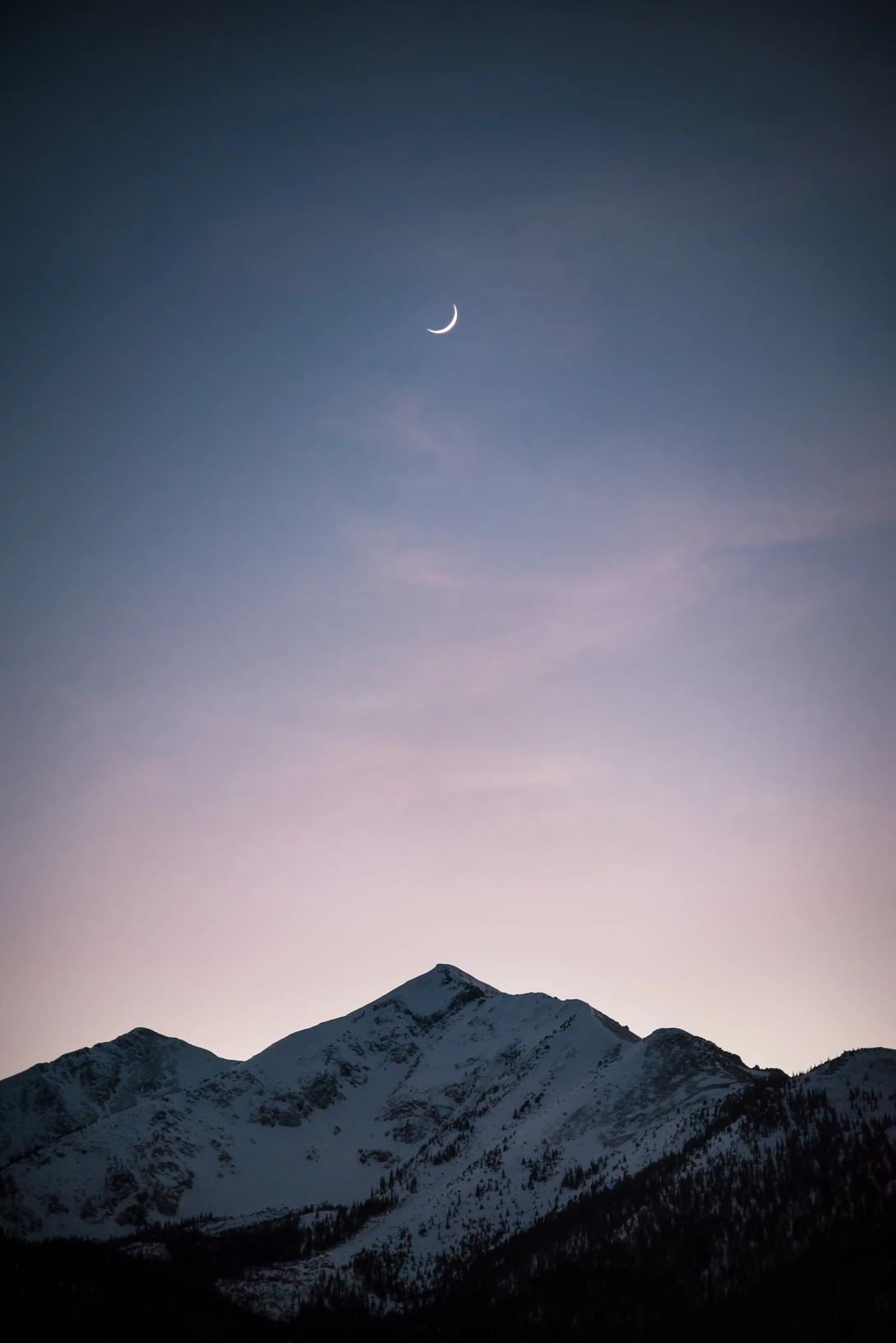 View Moonrise Over the Rockies by Trevor Parker