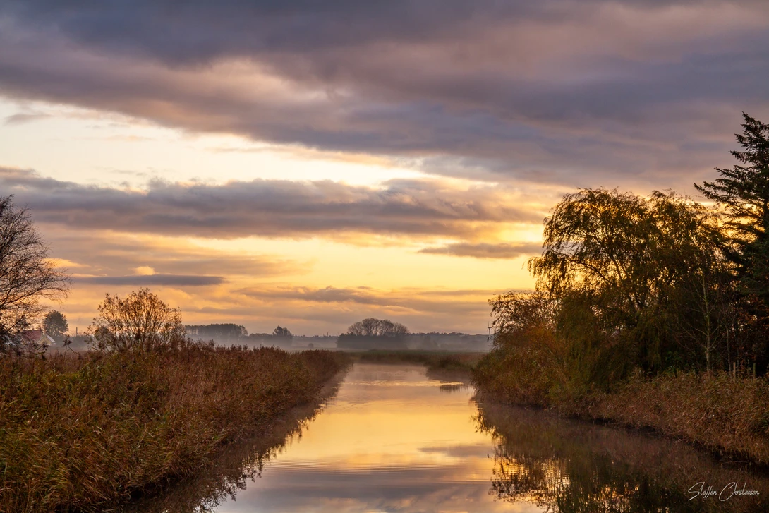 View The fog and sun started to play by Steffen Christensen
