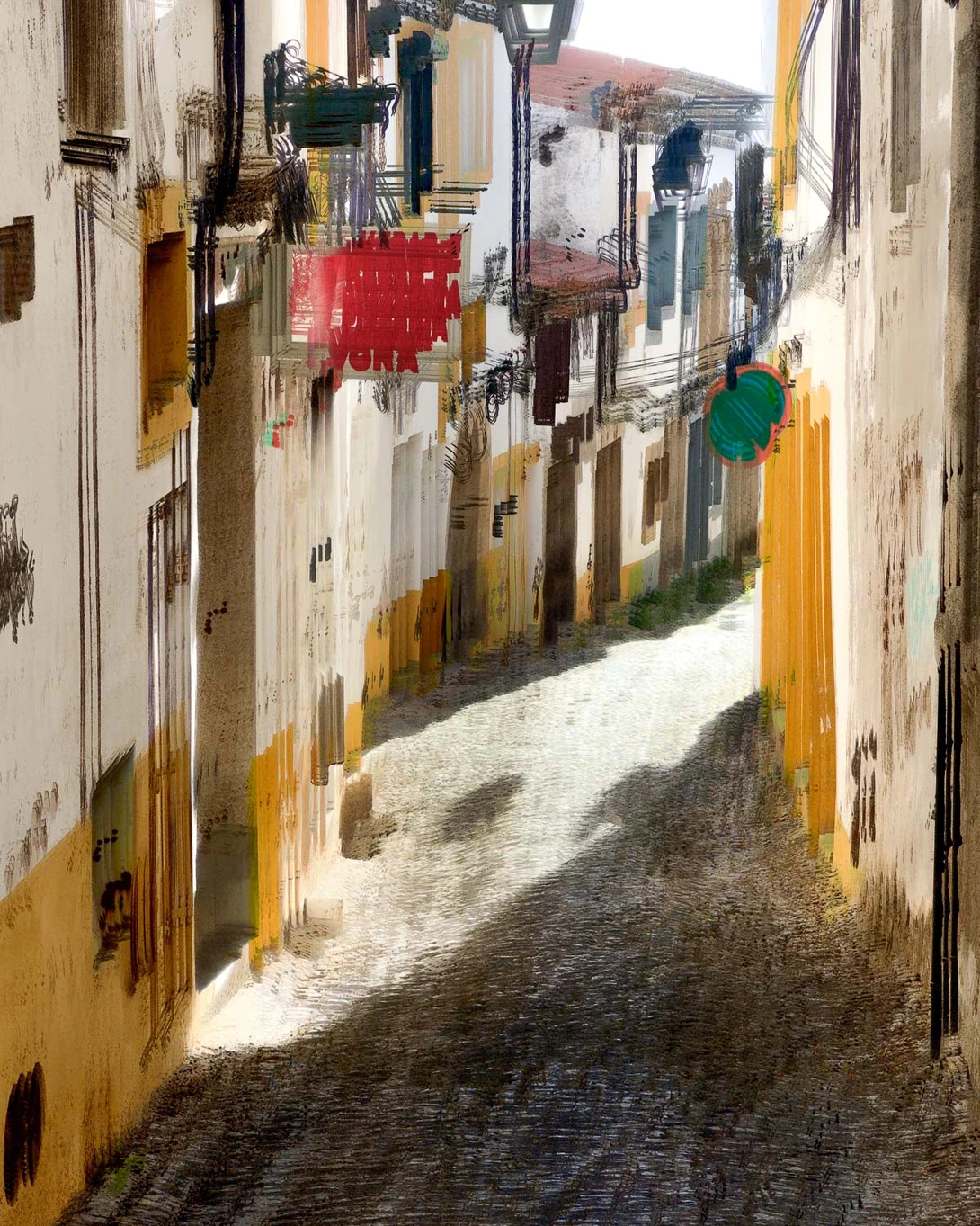 Narrow cobblestone street lined with weathered colonial buildings in warm earth tones