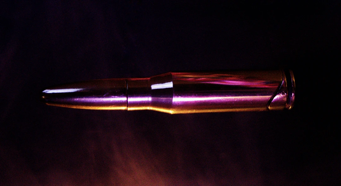 View Suspended Bullet (revised) by Garrett Cox