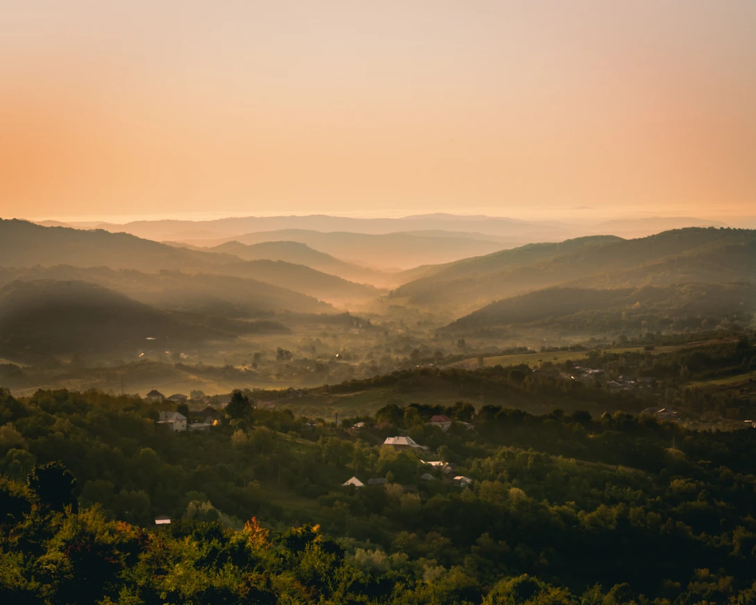 View Misty sunrise over the mountains by Bogdan Domsa