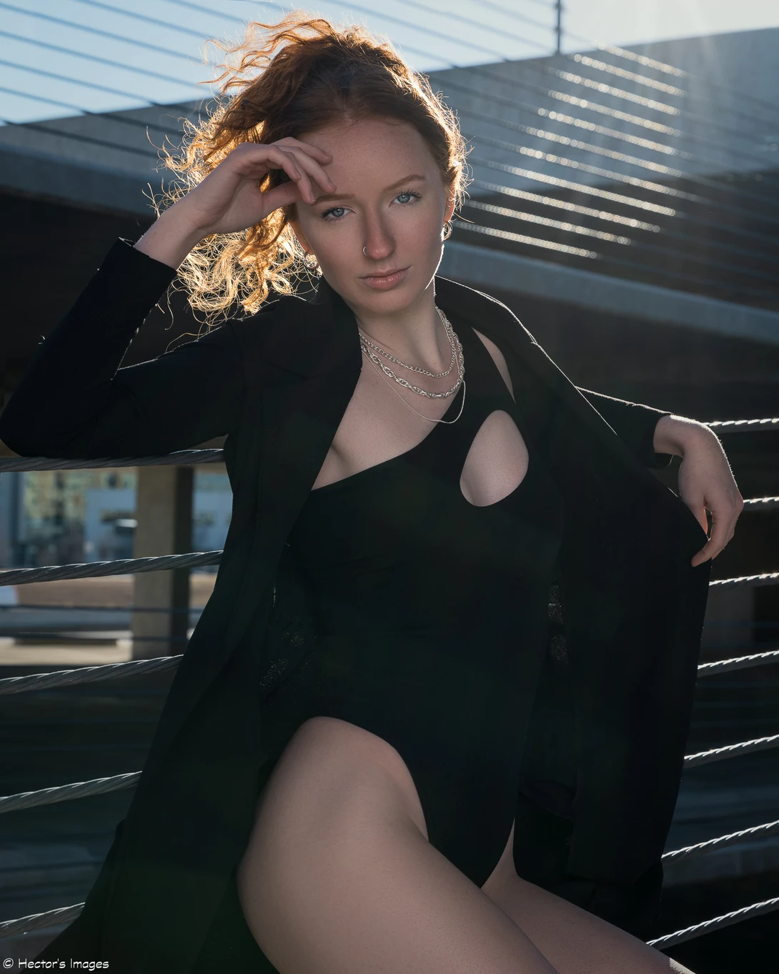 View Marissa's black bodysuit by Hector Reyes